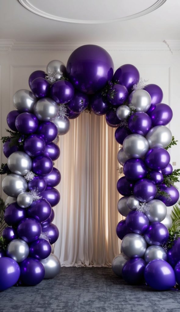 An arch made of large purple and silver balloons stands in front of cream-colored curtains in a room with white walls and gray carpet.