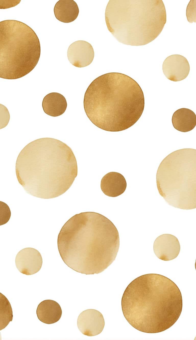 Watercolor polka dots in warm golden hues scattered across a white backdrop, resembling drifting flecks of golden pigment.